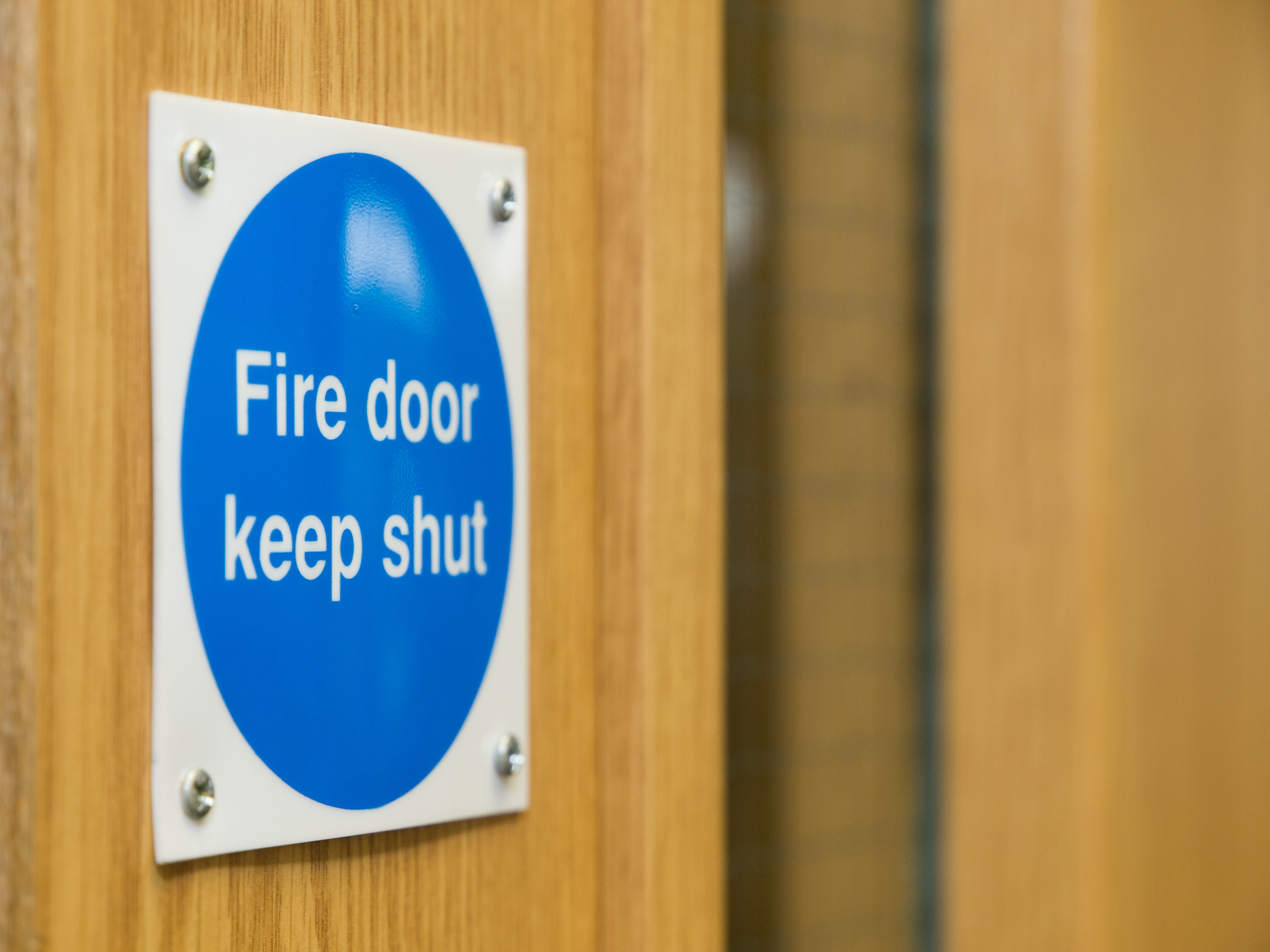 Certified fire door in a commercial building corridor in Ipswich
